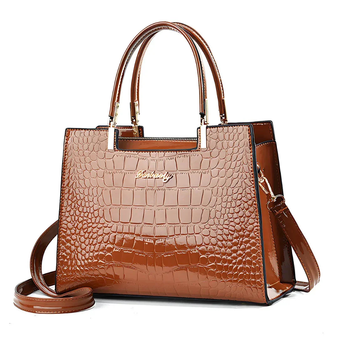 Brown crocodile pattern leather handbag with gold hardware and top handle
