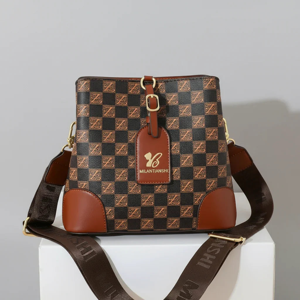 Brown checkerboard MILANTIANSII crossbody bag with wide strap on white box