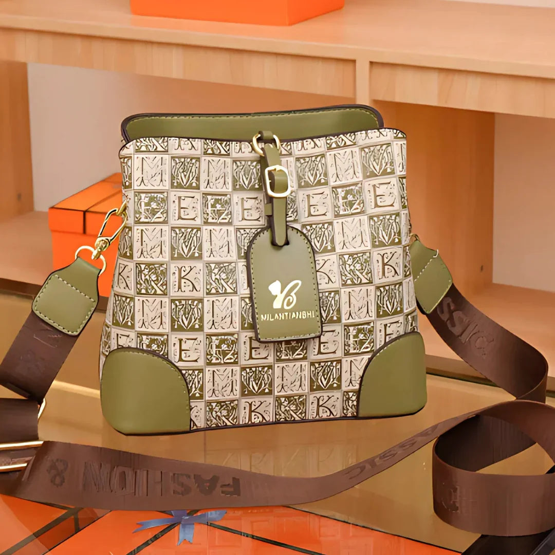 Green and beige MILANTIABHI handbag with patterned design and brown FASHION strap on a table