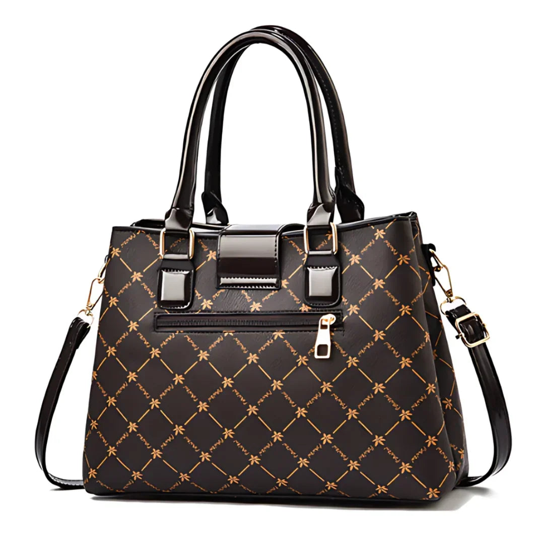 Black leather handbag with gold geometric pattern, top handles, and detachable strap