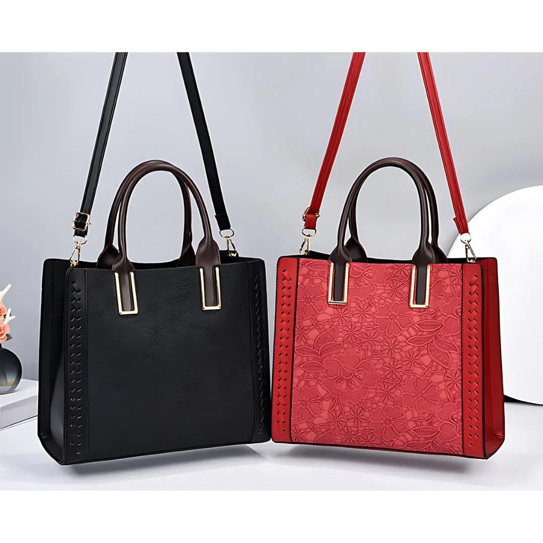Black and red leather handbags with floral embossed patterns and top handles