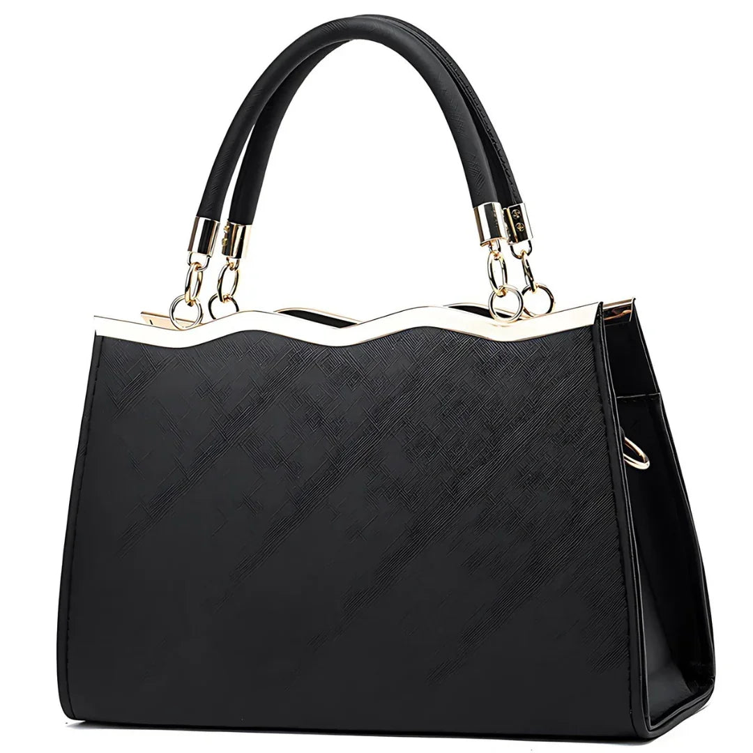 Elegant black handbag with gold trim and dual handles on a white background