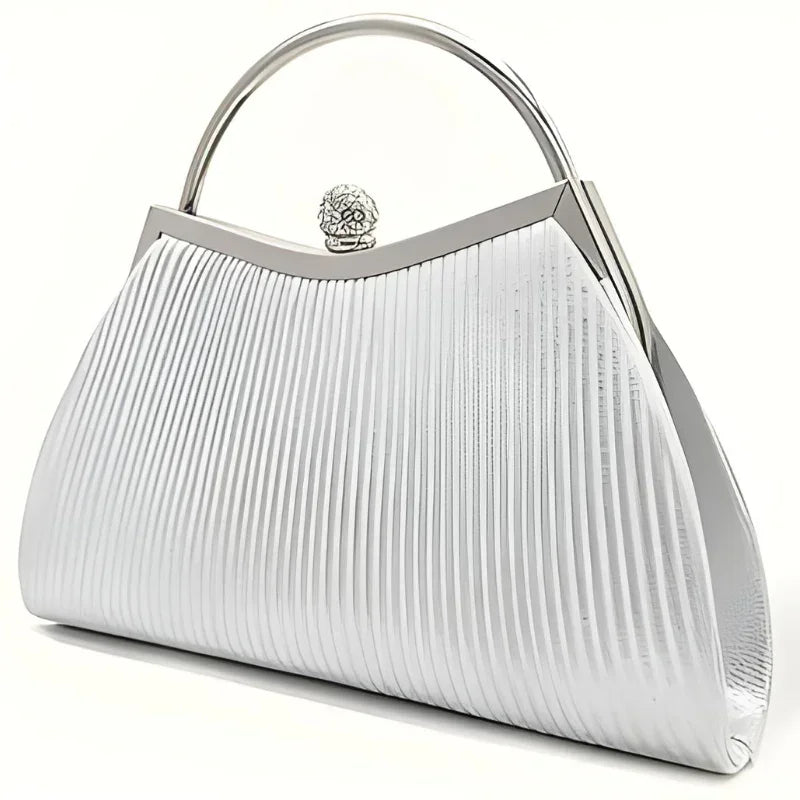 Elegant silver metallic pleated clutch purse with top handle and ornate clasp