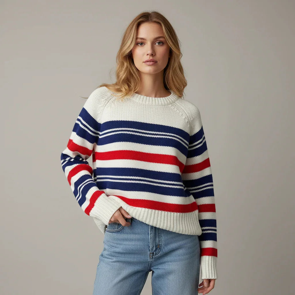 Woman wearing a striped Vintage sweater with a neutral background
