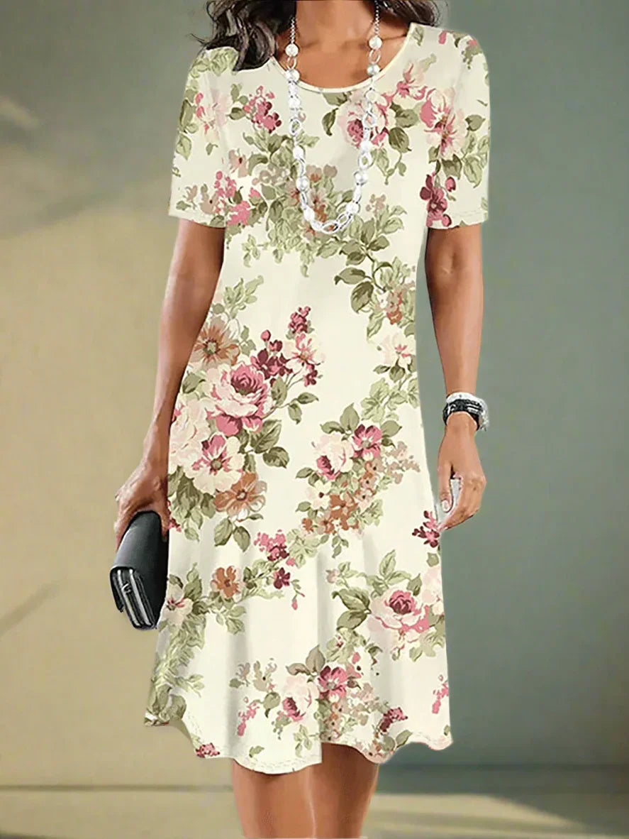 Woman wearing a floral dress with a neutral background