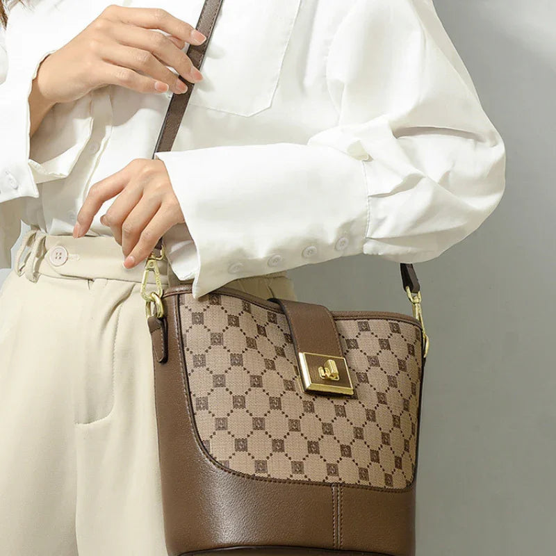 Woman wearing white blouse and beige trousers with brown leather crossbody purse