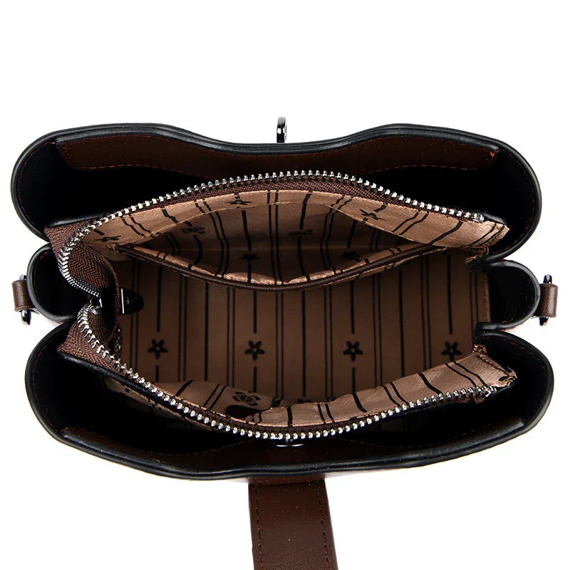 Top view of brown purse with floral striped fabric lining and zipper compartment