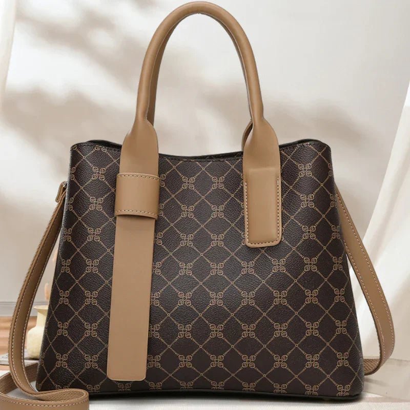 Brown leather designer handbag with beige handles and geometric pattern design