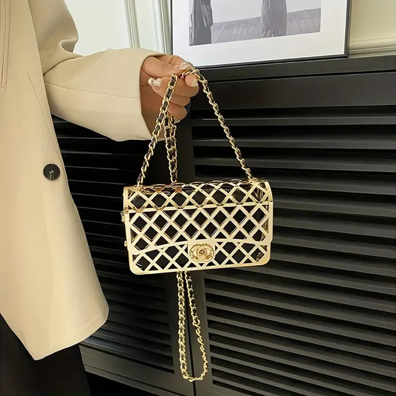 Gold lattice chain shoulder bag held by person in beige blazer, stylish handbag fashion