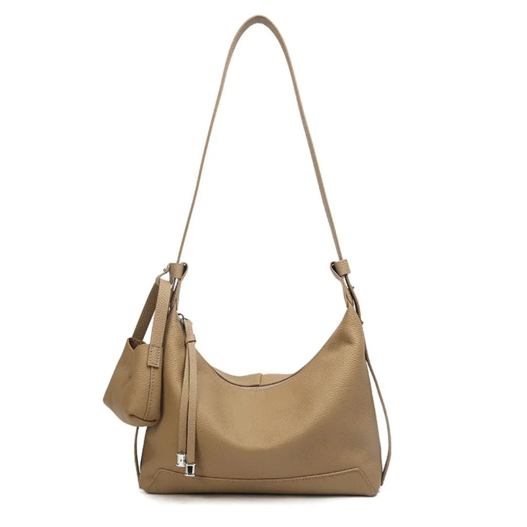Beige leather shoulder bag with matching pouch, minimalist design, silver hardware