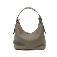 Taupe pebbled leather hobo bag with top handle on white background
