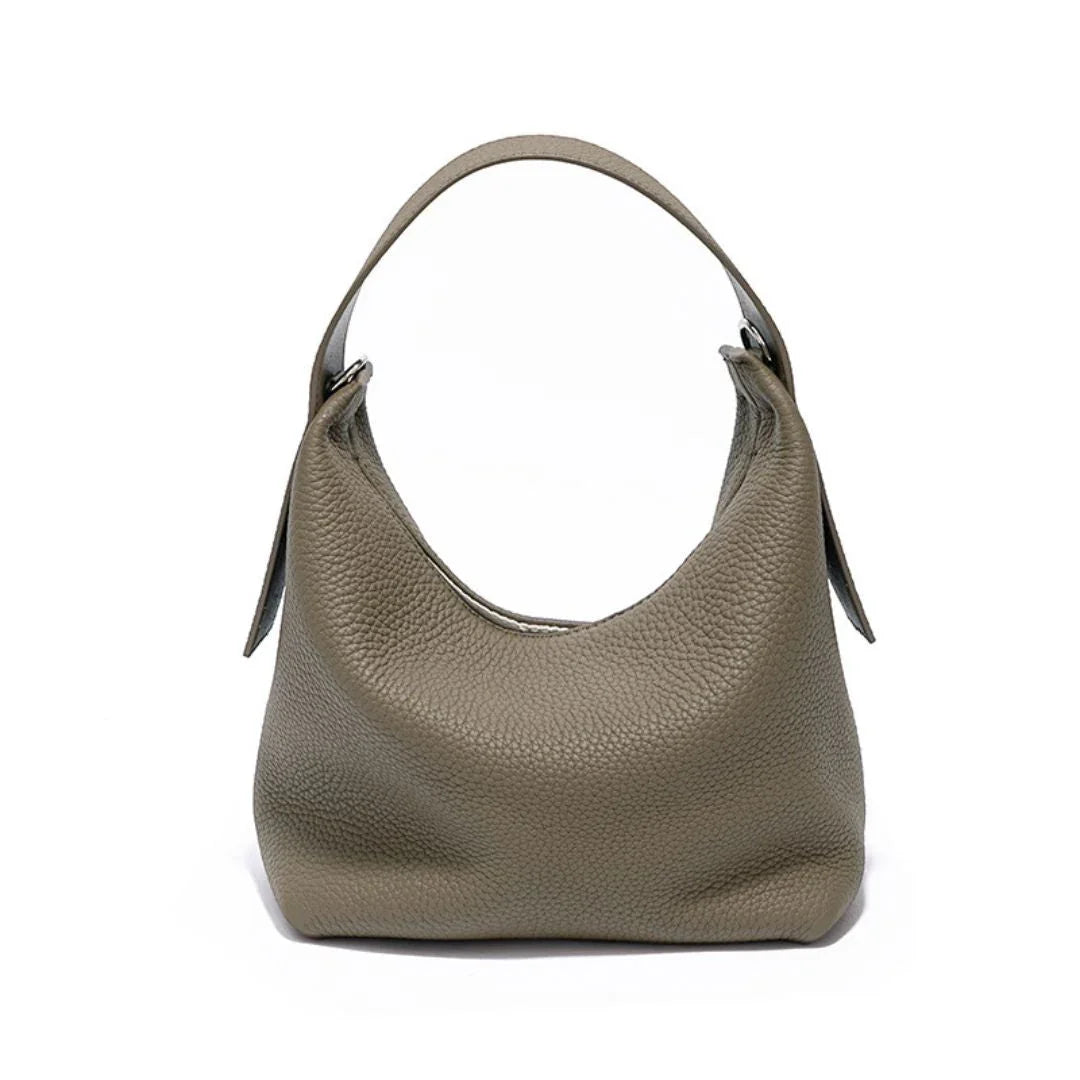 Taupe pebbled leather hobo bag with top handle on white background