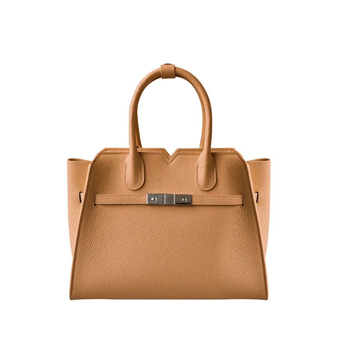 Tan leather tote handbag with double handles and silver buckle on white background