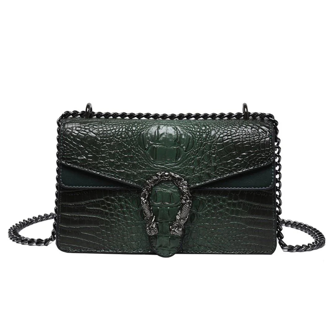 Dark green crocodile embossed leather shoulder bag with chain strap and ornate buckle detail