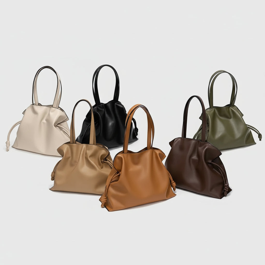 Assorted soft leather tote bags in beige, black, tan, brown, and olive on a white background