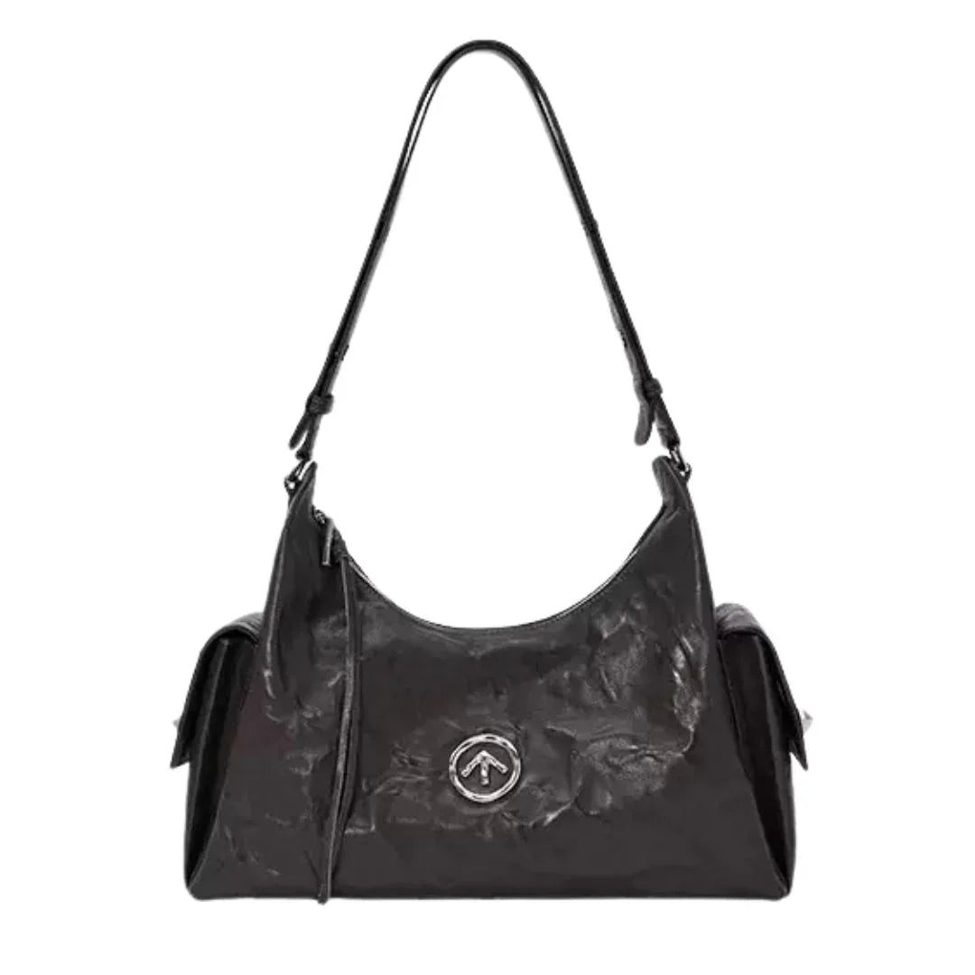 Black leather shoulder bag with textured finish and silver emblem on front, fashion accessory