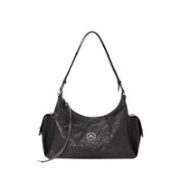 Black leather shoulder bag with logo, side pockets, and adjustable strap on white background
