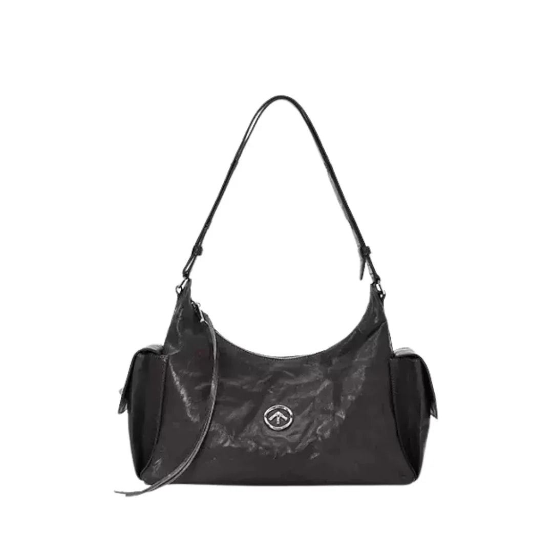 Black leather shoulder bag with logo, side pockets, and adjustable strap on white background