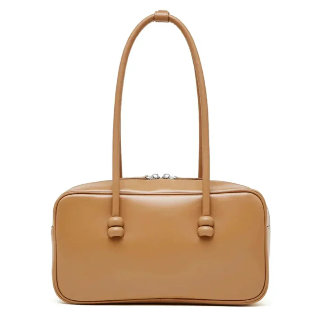 Tan rectangular leather handbag with double top handles on a white background