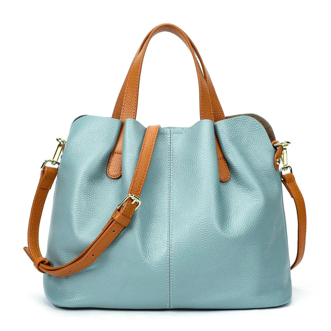Light blue leather tote bag with brown leather handles and shoulder strap