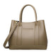 Taupe leather tote bag with two handles and detachable shoulder strap on white background