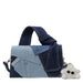 Denim patchwork handbag with a large handle and fluffy white cloud keychain accessory