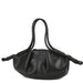 Black leather handbag with double handles and knotted ends against white background