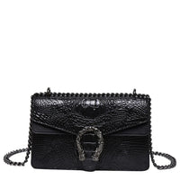Black crocodile-embossed leather shoulder bag with metal chain strap and decorative buckle