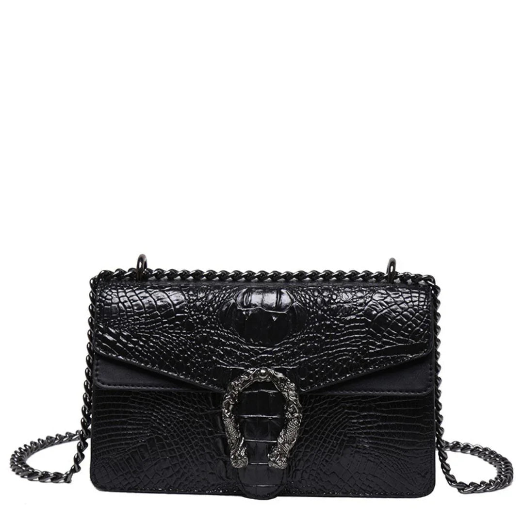 Black crocodile-embossed leather shoulder bag with metal chain strap and decorative buckle