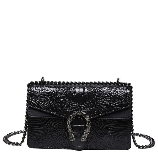 Black crocodile-embossed leather shoulder bag with metal chain strap and decorative buckle