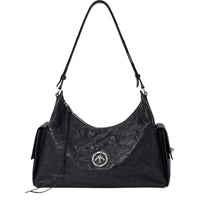 Black leather shoulder bag with silver round logo, front zipper, and side pockets