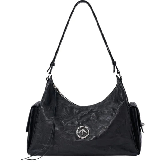Black leather shoulder bag with silver round logo, front zipper, and side pockets