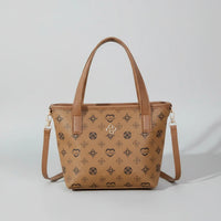 Brown leather patterned tote bag with shoulder strap on a neutral background