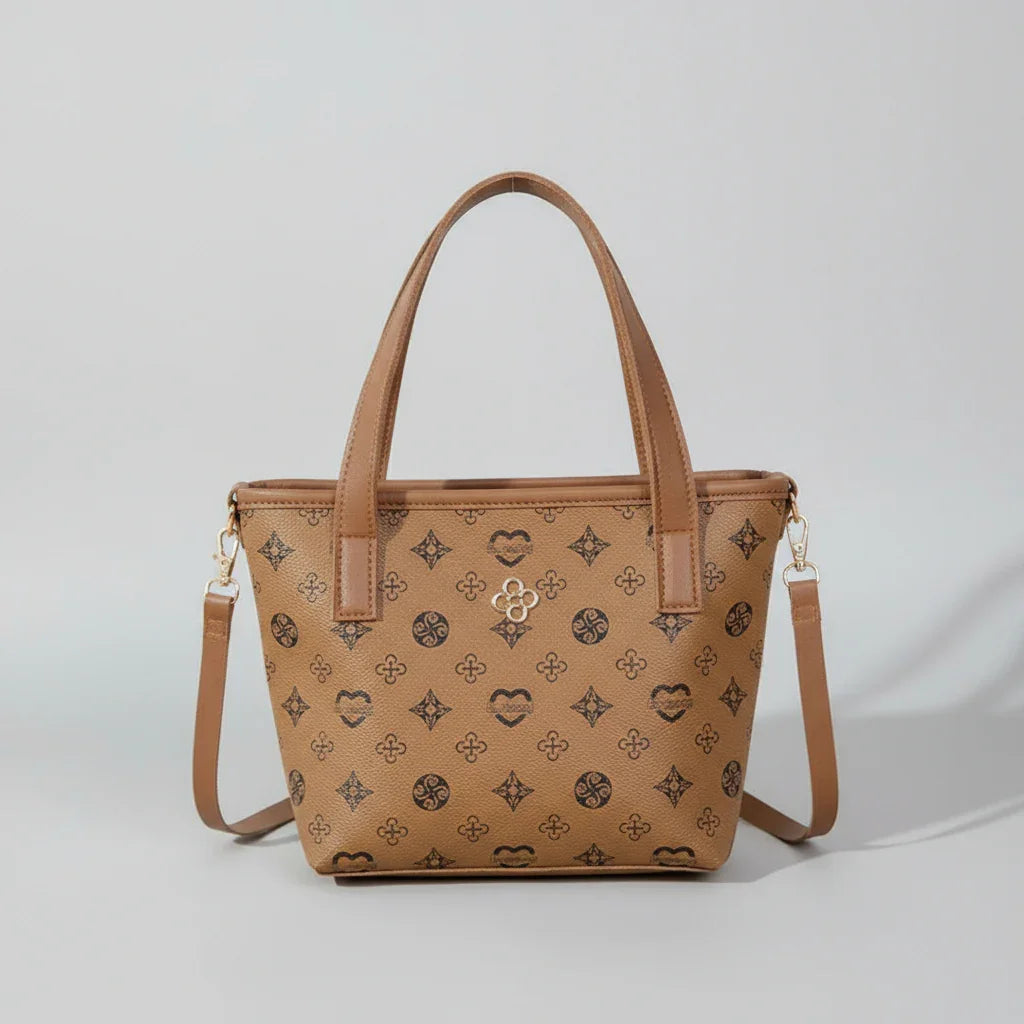Brown leather patterned tote bag with shoulder strap on a neutral background
