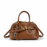 Brown leather handbag with gold-tone hardware, top handles, and detachable shoulder strap