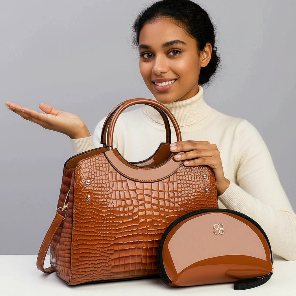 Smiling woman with brown crocodile leather handbag and matching glossy pouch on table