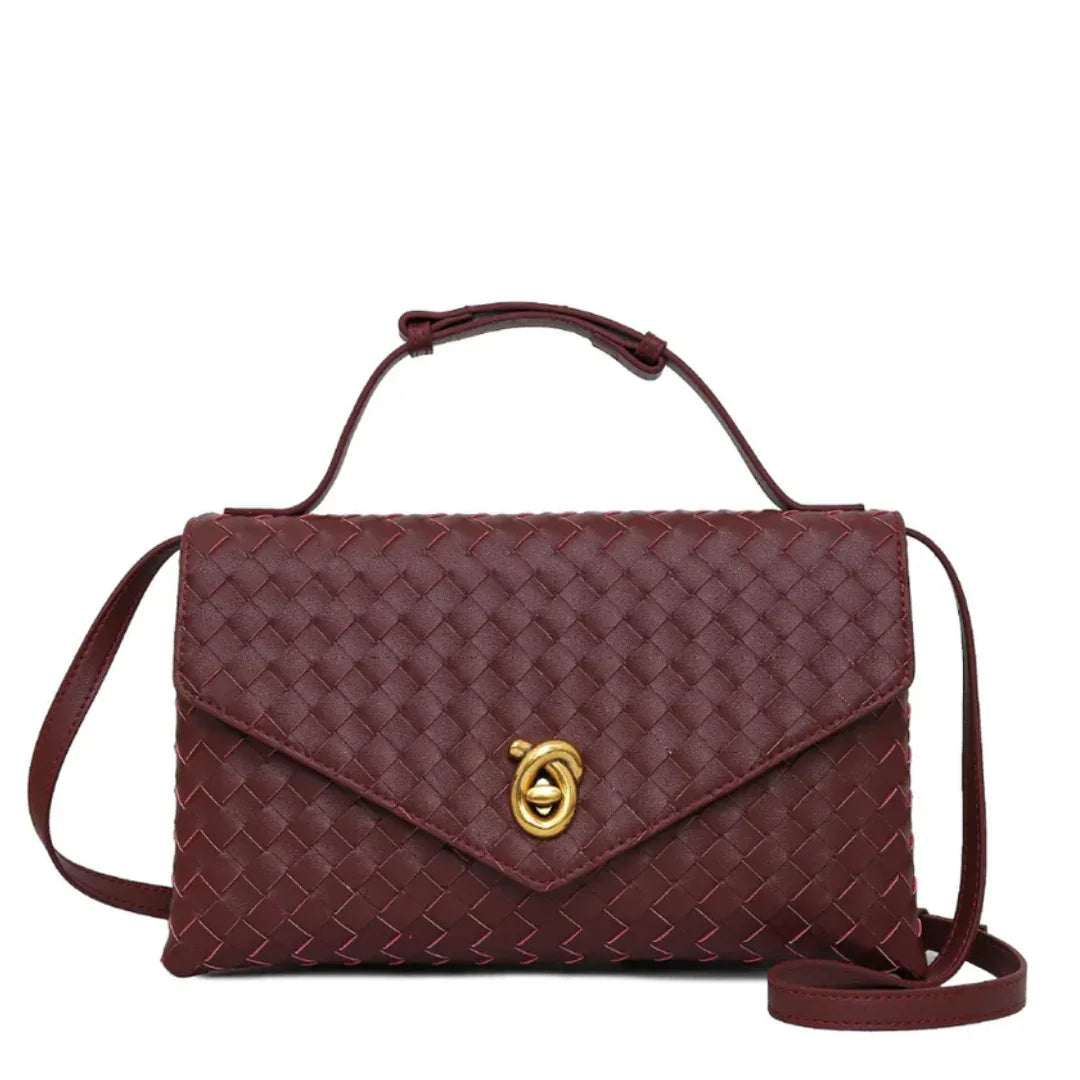 Woven burgundy leather crossbody handbag with gold twist lock and top handle