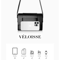 Black VELOISSE crossbody bag with iPhone, icons showing item fit comparison below.