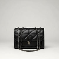 Black quilted leather handbag with chain strap and metal clasp on white background