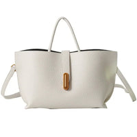 White leather handbag with top handle, gold accent, and adjustable shoulder strap