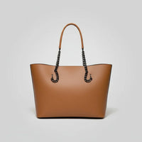 Brown leather tote bag with chain handles on a plain white background