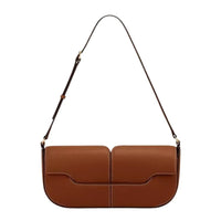Brown leather shoulder bag with white stitching and adjustable strap on white background