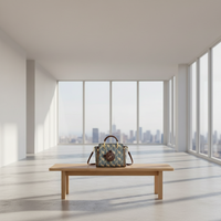 Patterned handbag on a wooden bench in a modern room with large windows