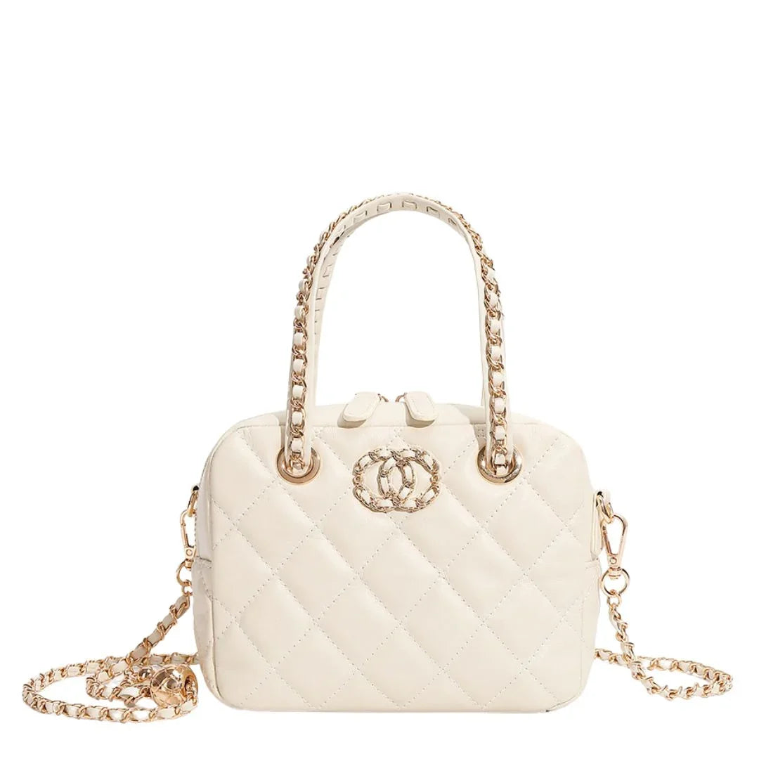 White quilted handbag with gold chain handles and decorative gold logo on front