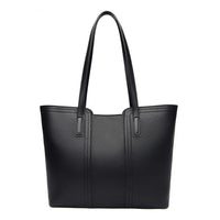 Black leather tote bag with double handles on white background