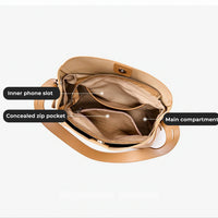 Open tan handbag showing main compartment, inner phone slot, and concealed zip pocket