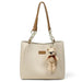 Beige leather tote bag with brown handles, gold chain, and teddy bear keychain charm