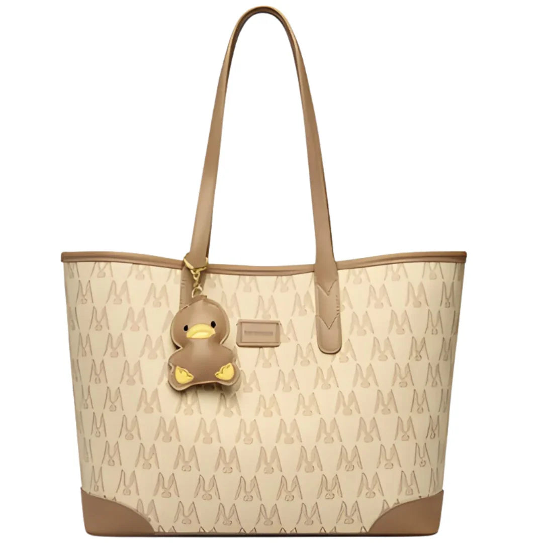 Beige tote bag with duck charm and monogram pattern, stylish shoulder handbag