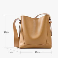 Tan leather shoulder bag with adjustable strap, 26x25x11cm, minimalist design