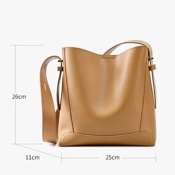 Tan leather shoulder bag with adjustable strap, 26x25x11cm, minimalist design
